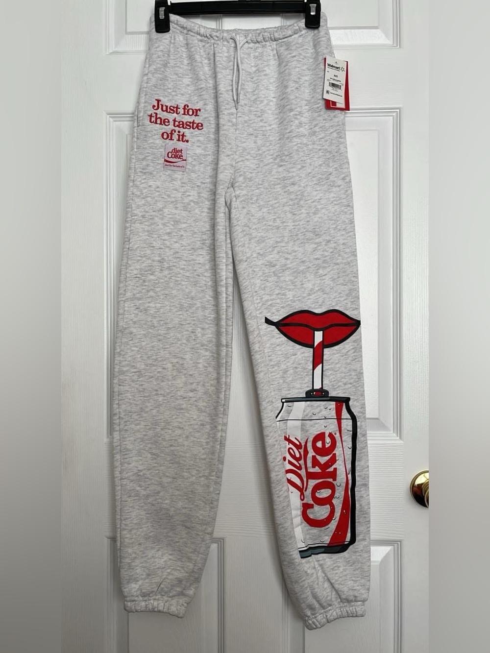 Coca-Cola Red and White Logo Tag on Light Gray Apparel
